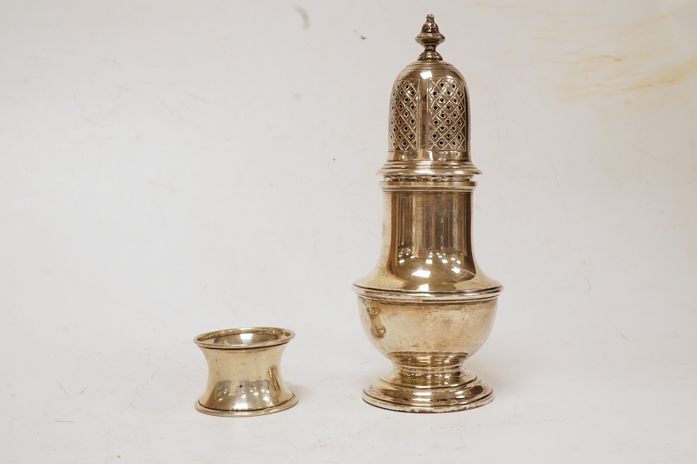 An Elizabeth II silver sugar caster, by Edward Barnard & Sons Ltd, London, 1959, 16.4cm, together with a silver napkin ring. Condition - fair